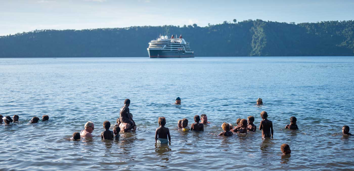 Locals paddle out to greet Seabourn Pursuit guests off Garove Island