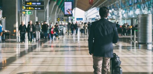man walking through airport