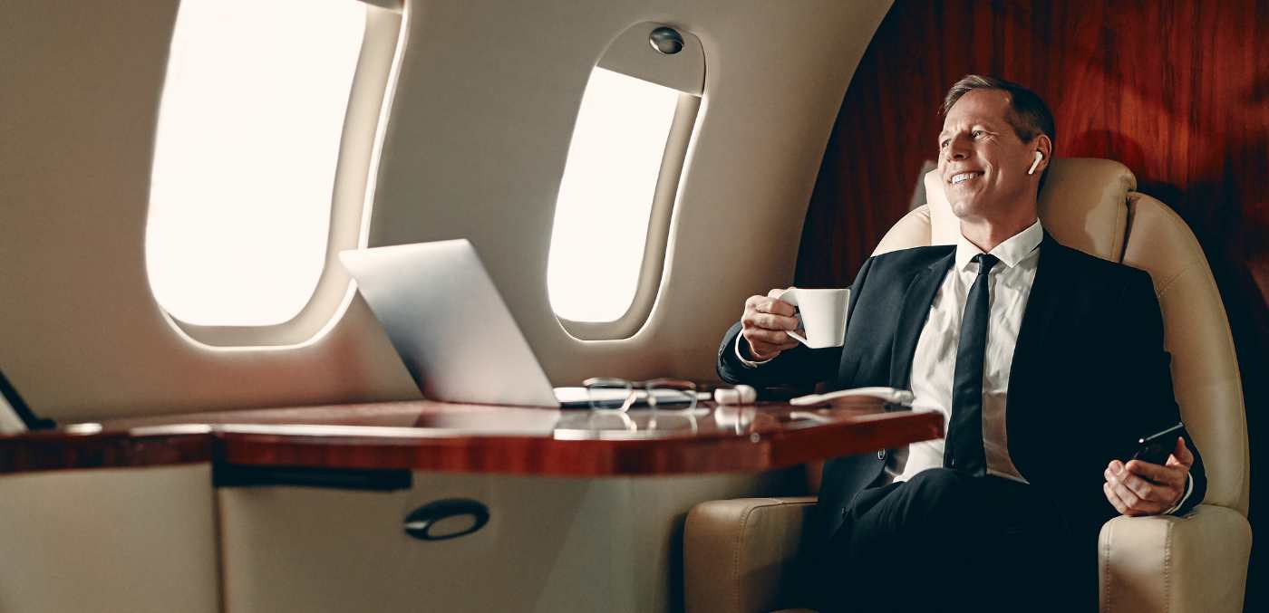 A man sitting in a private jet