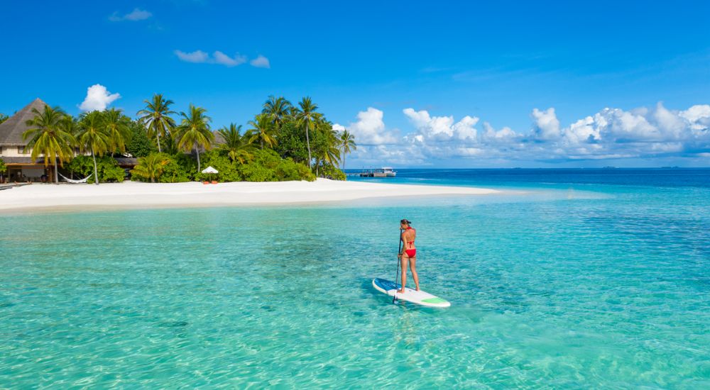 Standup paddle boarding at Mirihi Island Resort, Maldives