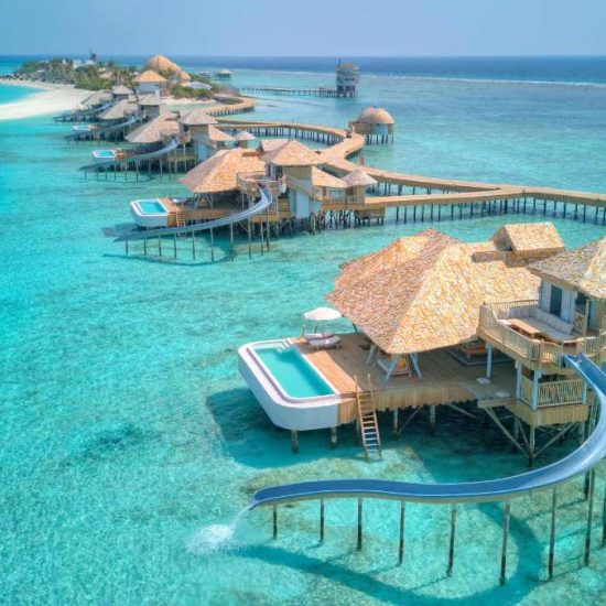 A row of overwater open-air villas in the maldives