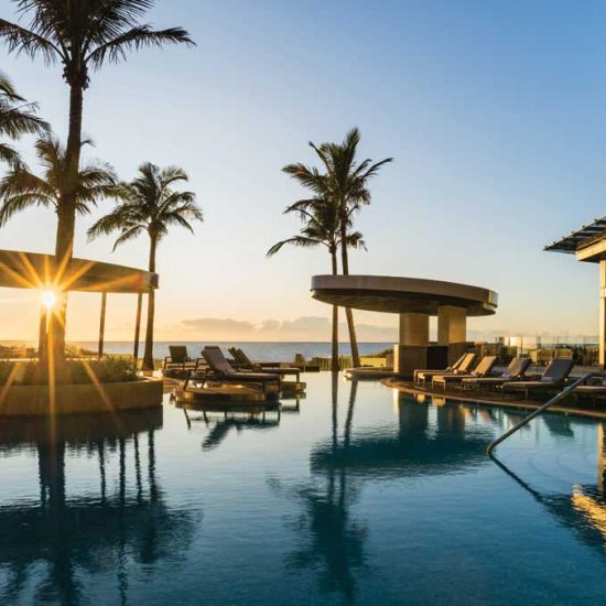 Lagoon pool with a swim up bar at The Langham, Gold Coast