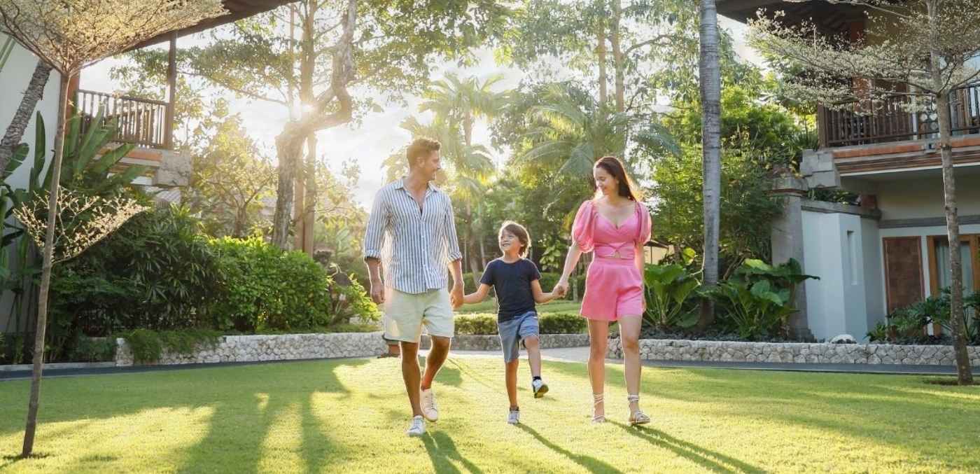 family walking through gardens